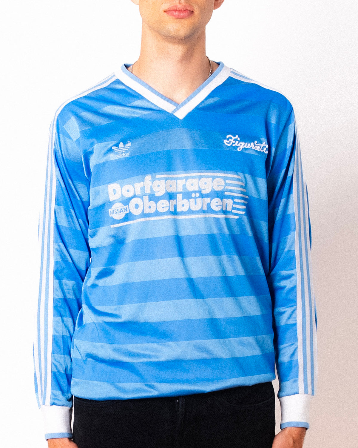 Vintage Adidas light blue striped long sleeve football shirt with Dorfgarage Oberburen sponsor and Figurati embroidery, front