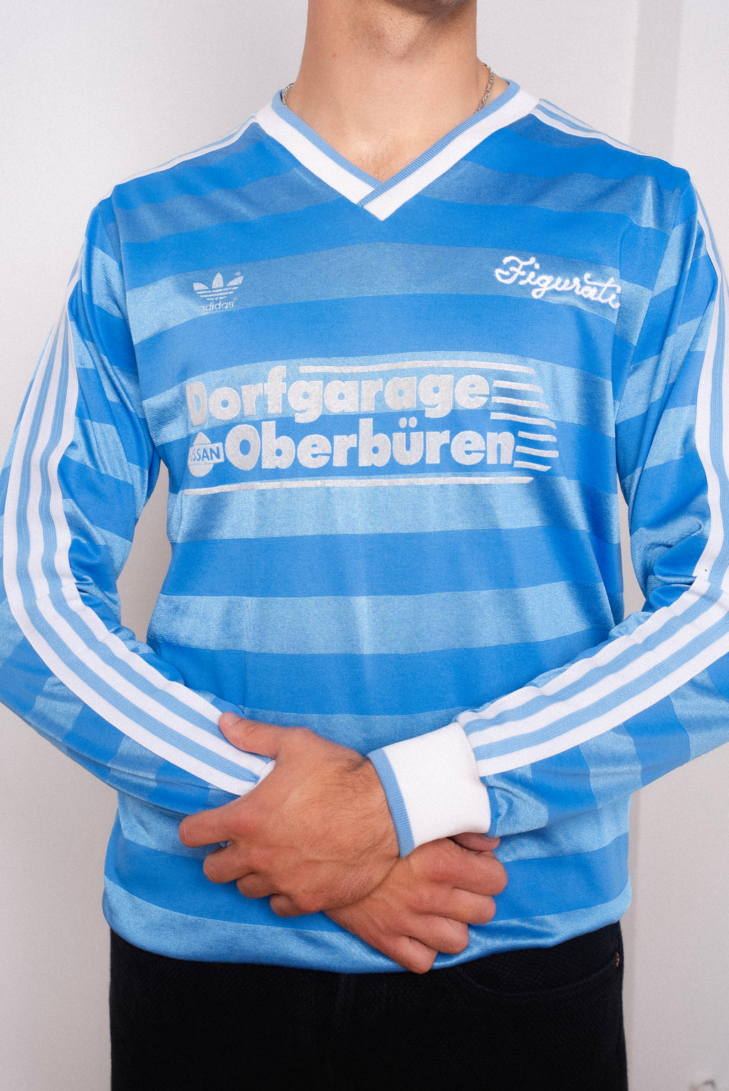 Vintage Adidas light blue striped long sleeve football shirt with Dorfgarage Oberburen sponsor and Figurati embroidery, styled