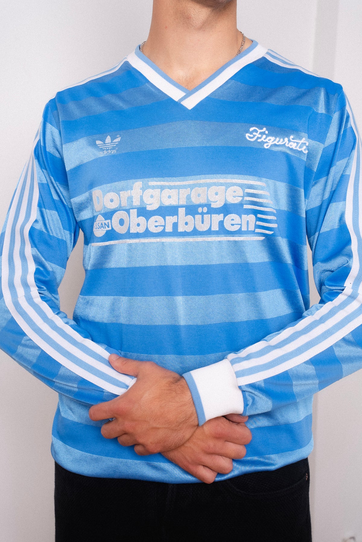 Vintage Adidas light blue striped long sleeve football shirt with Dorfgarage Oberburen sponsor and Figurati embroidery, styled