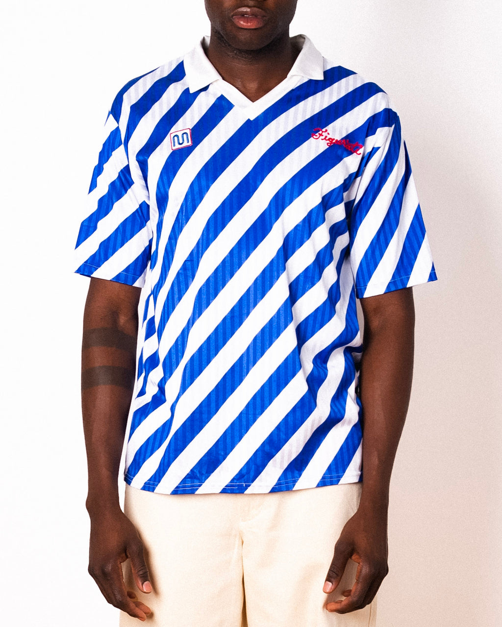 Vintage Meyba blue and white diagonal stripe short sleeve football shirt with Figurati embroidery, front