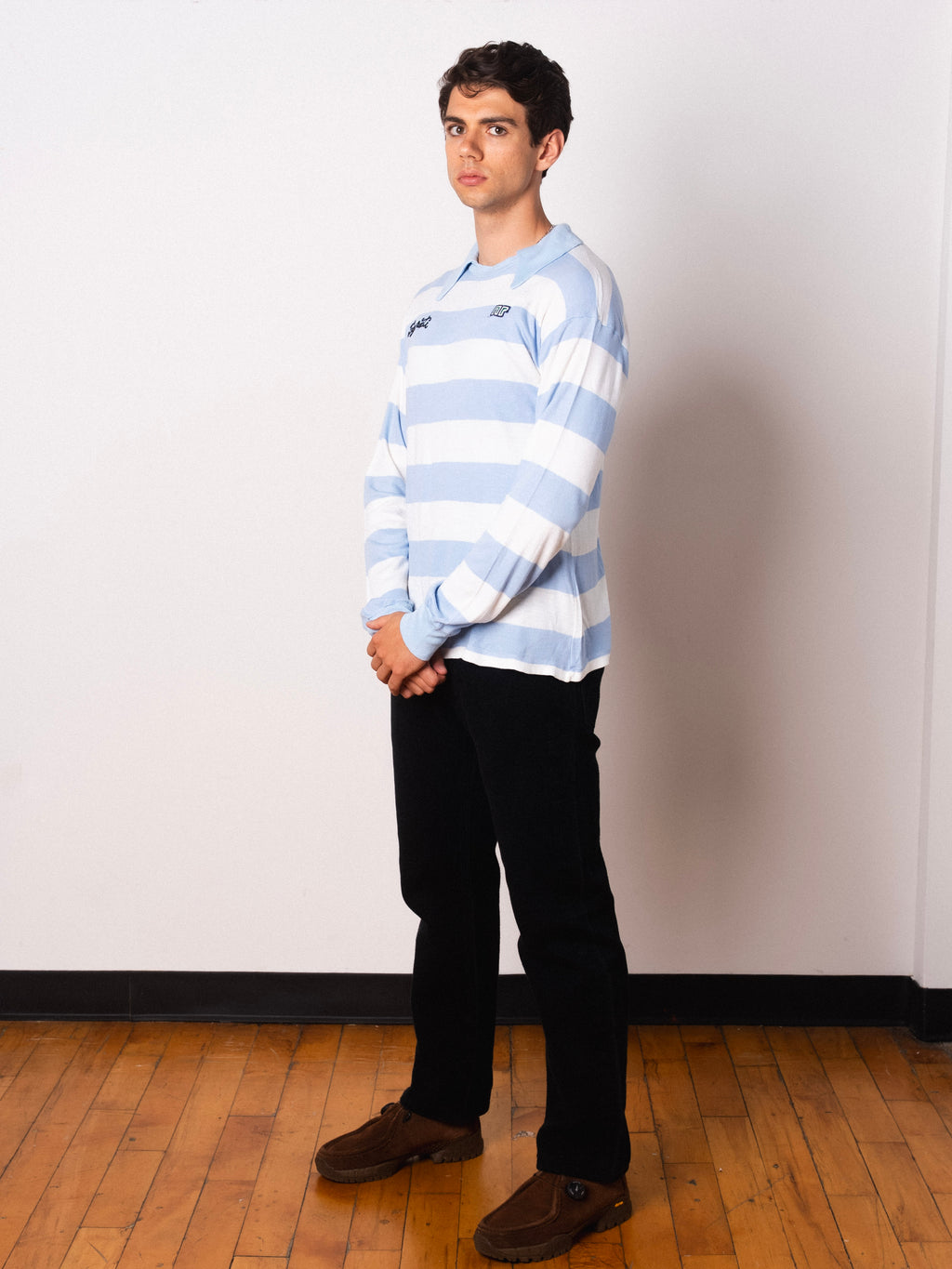 Vintage Ennerre light blue and white hooped long sleeve football shirt with Figurati embroidery, full body front