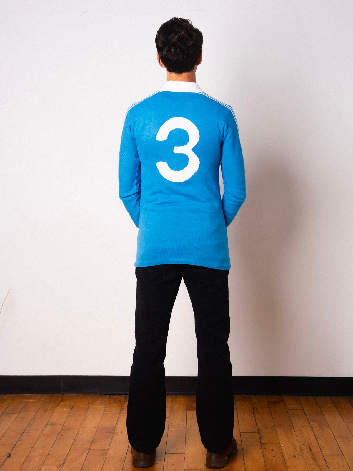 Vintage Ennerre sky blue long sleeve football shirt with Figurati embroidery, full body back