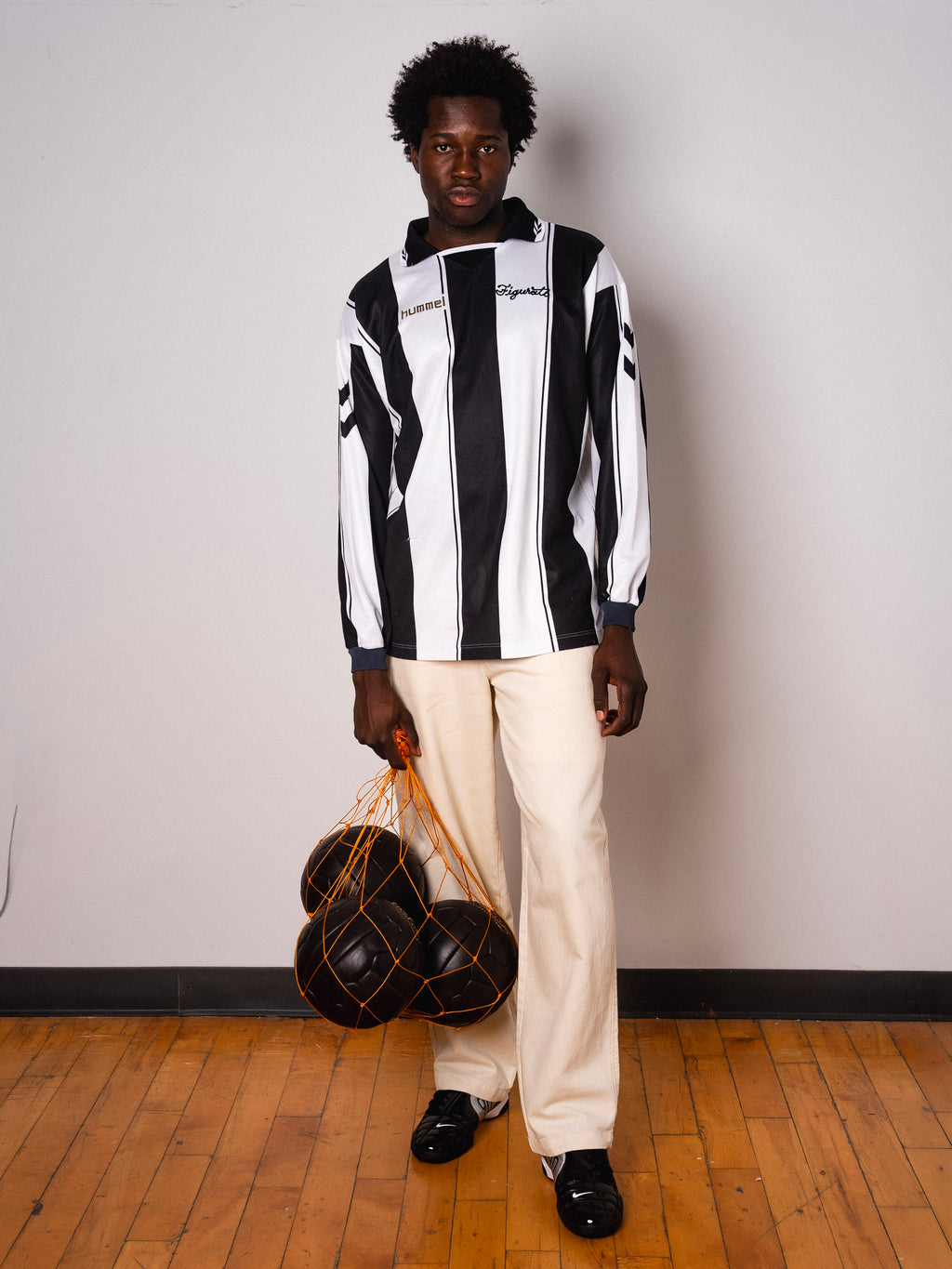 Vintage Hummel black and white striped long sleeve football shirt with Figurati embroidery, full body front