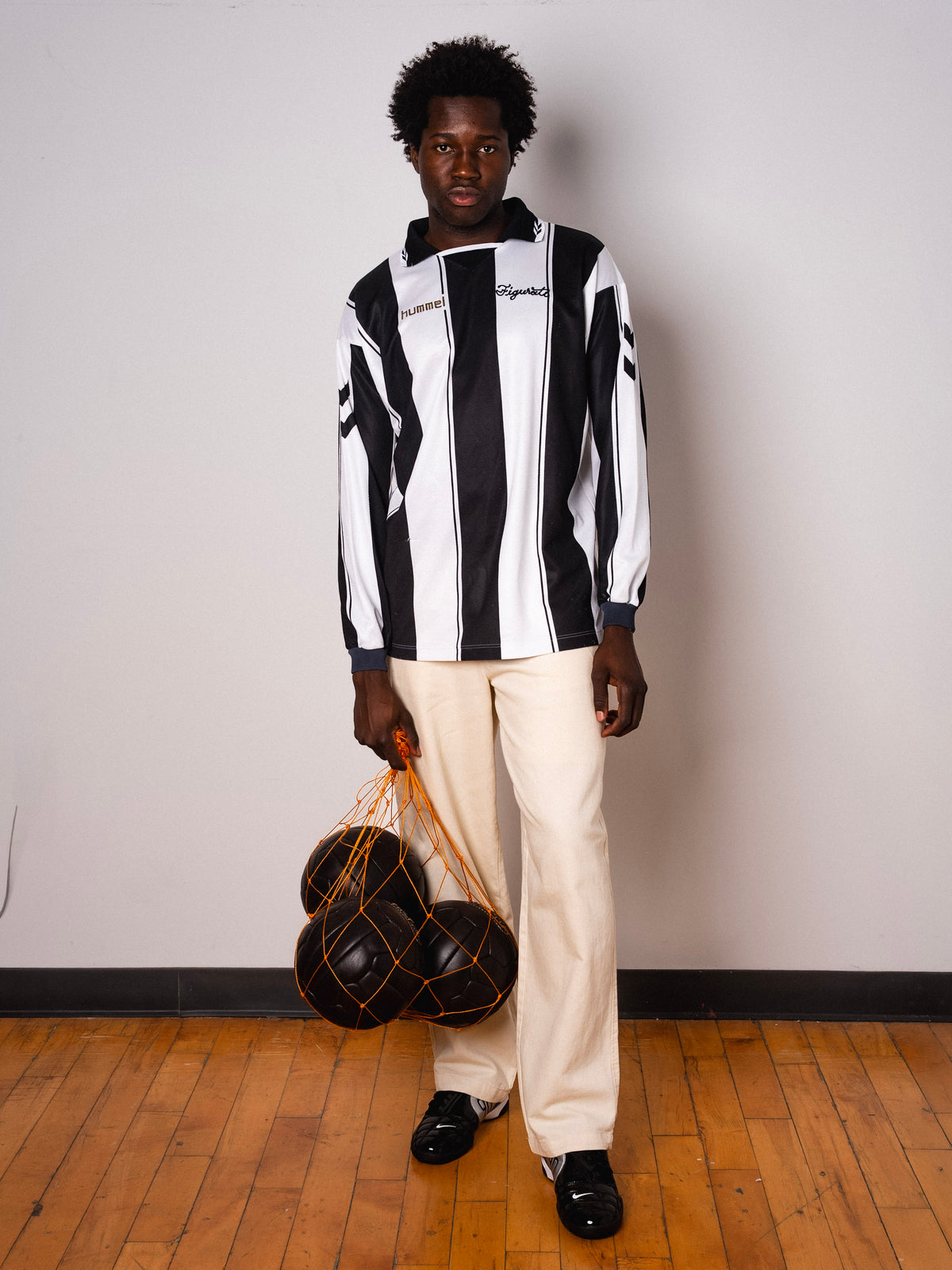 Vintage Hummel black and white striped long sleeve football shirt with Figurati embroidery, full body front