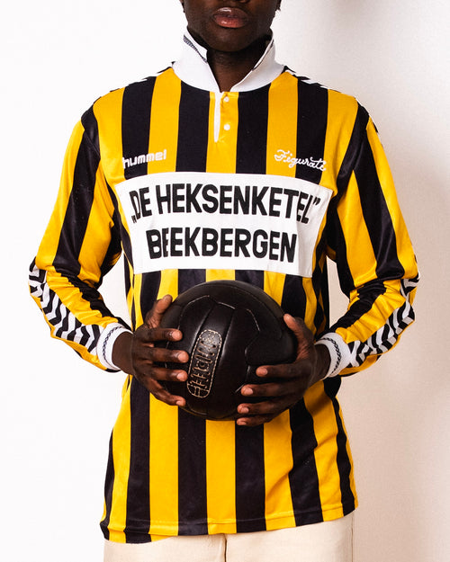 Vintage Hummel yellow and black striped long sleeve football shirt with De Heksenketel Beekbergen sponsor and Figurati embroidery, front