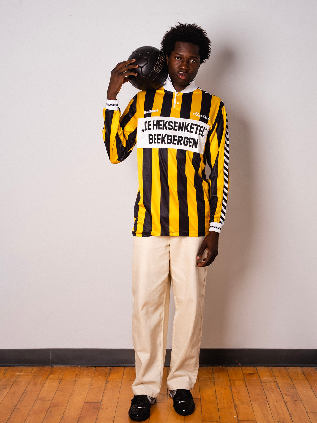 Vintage Hummel yellow and black striped long sleeve football shirt with De Heksenketel Beekbergen sponsor and Figurati embroidery, full body front
