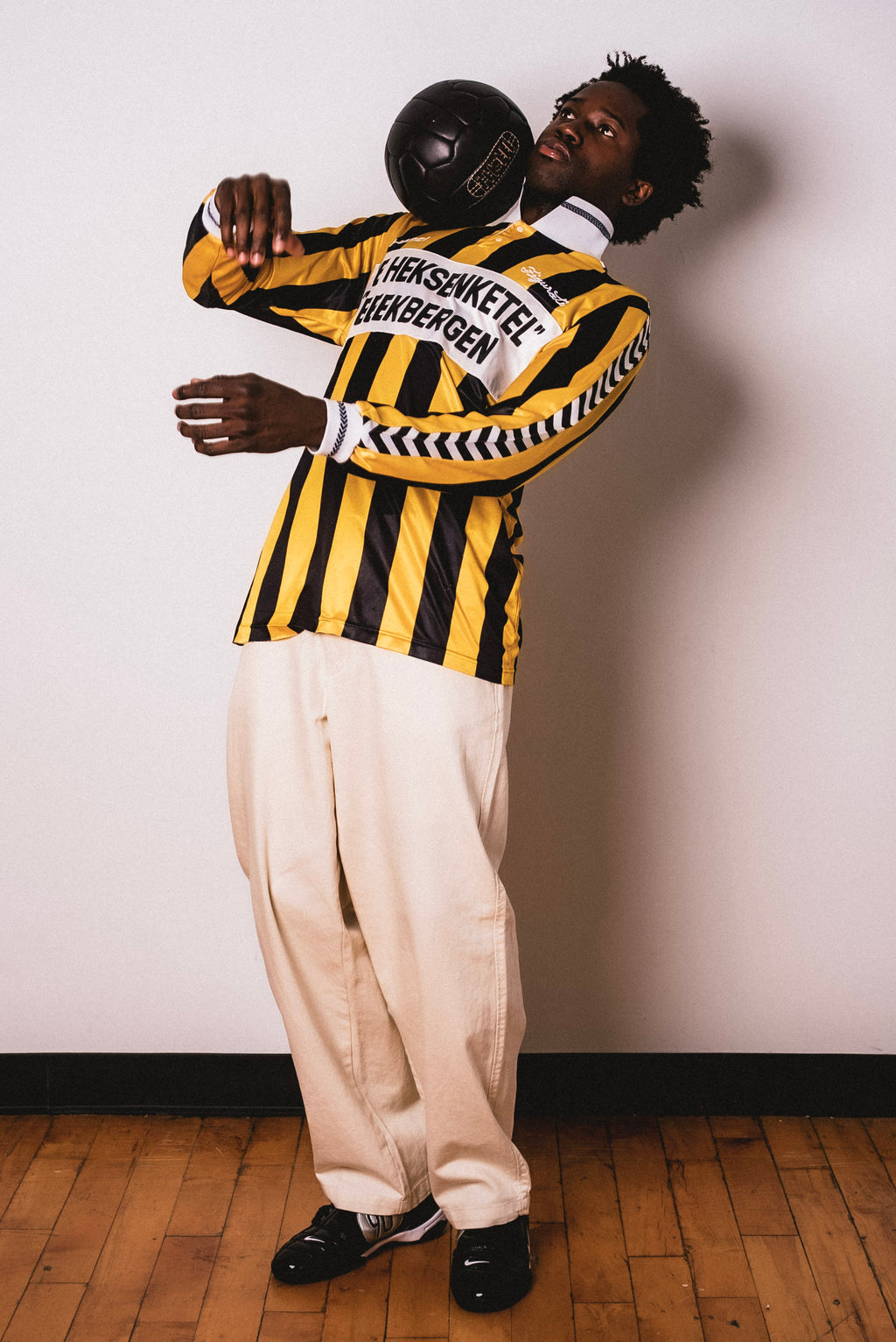 Vintage Hummel yellow and black striped long sleeve football shirt with De Heksenketel Beekbergen sponsor and Figurati embroidery, styled