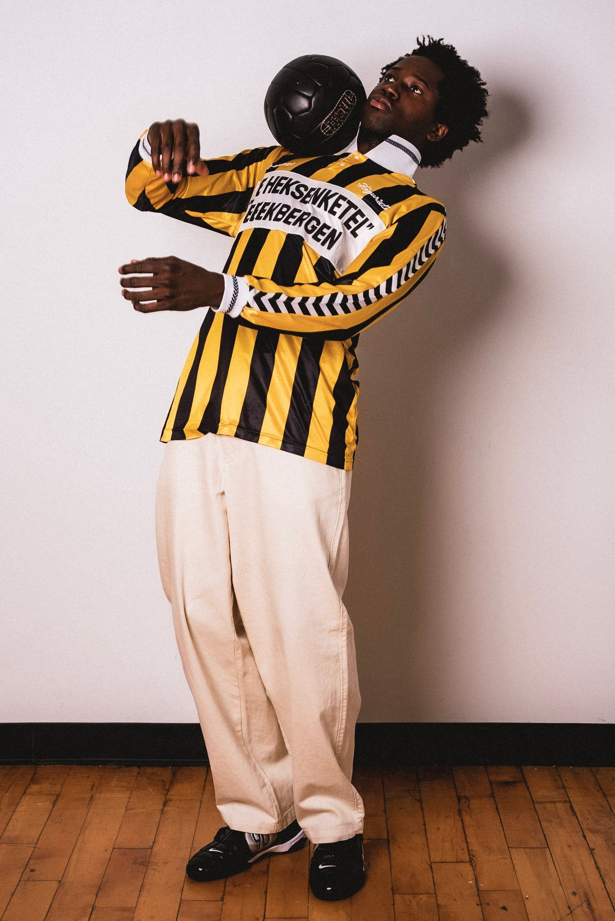 Vintage Hummel yellow and black striped long sleeve football shirt with De Heksenketel Beekbergen sponsor and Figurati embroidery, styled