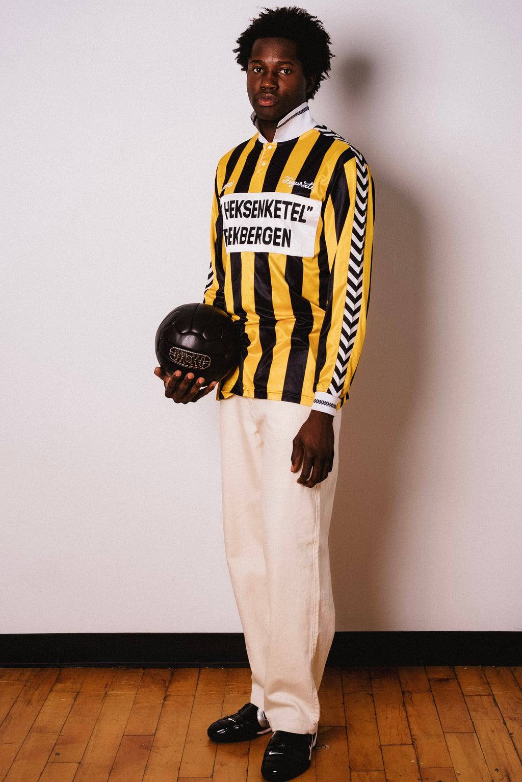 Vintage Hummel yellow and black striped long sleeve football shirt with De Heksenketel Beekbergen sponsor and Figurati embroidery, styled