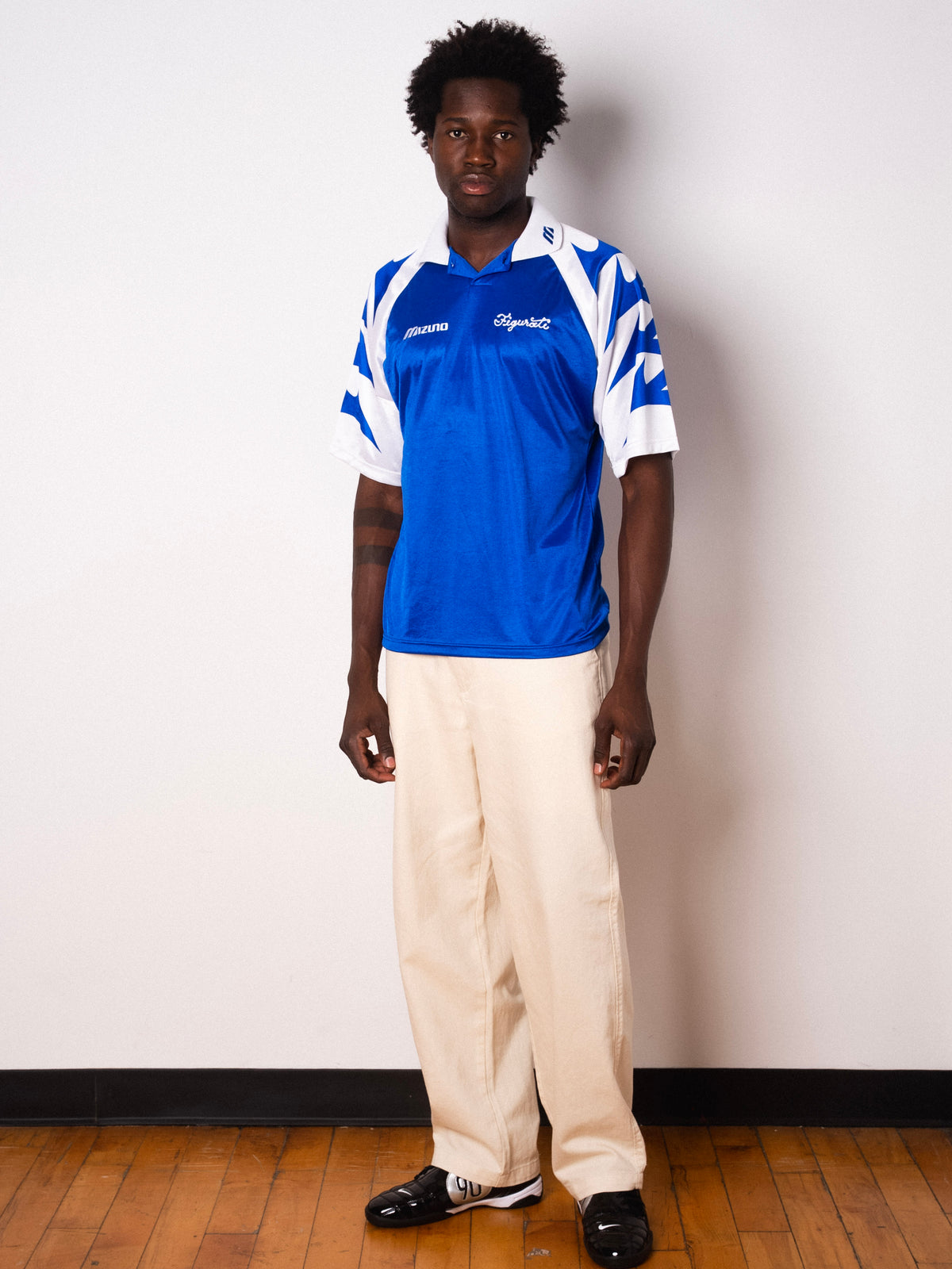 Vintage Mizuno blue and white short sleeve football shirt with Figurati embroidery, full body front