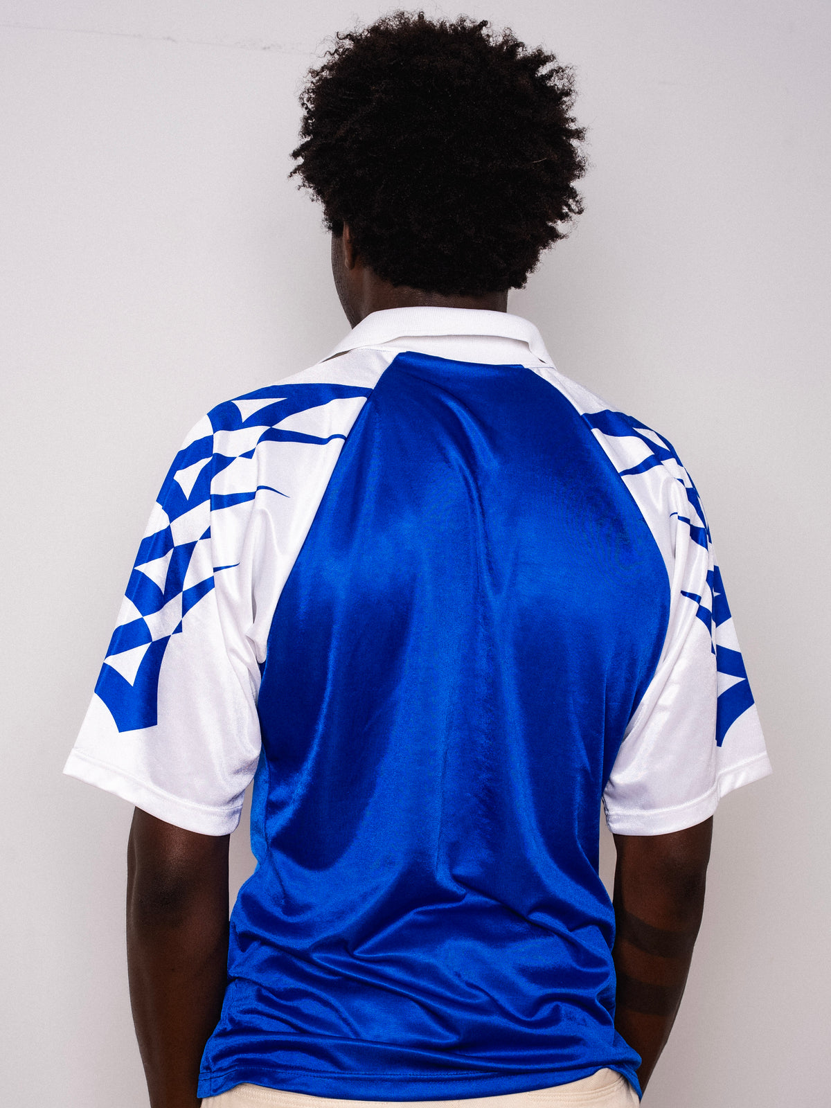 Vintage Mizuno blue and white short sleeve football shirt with Figurati embroidery, back