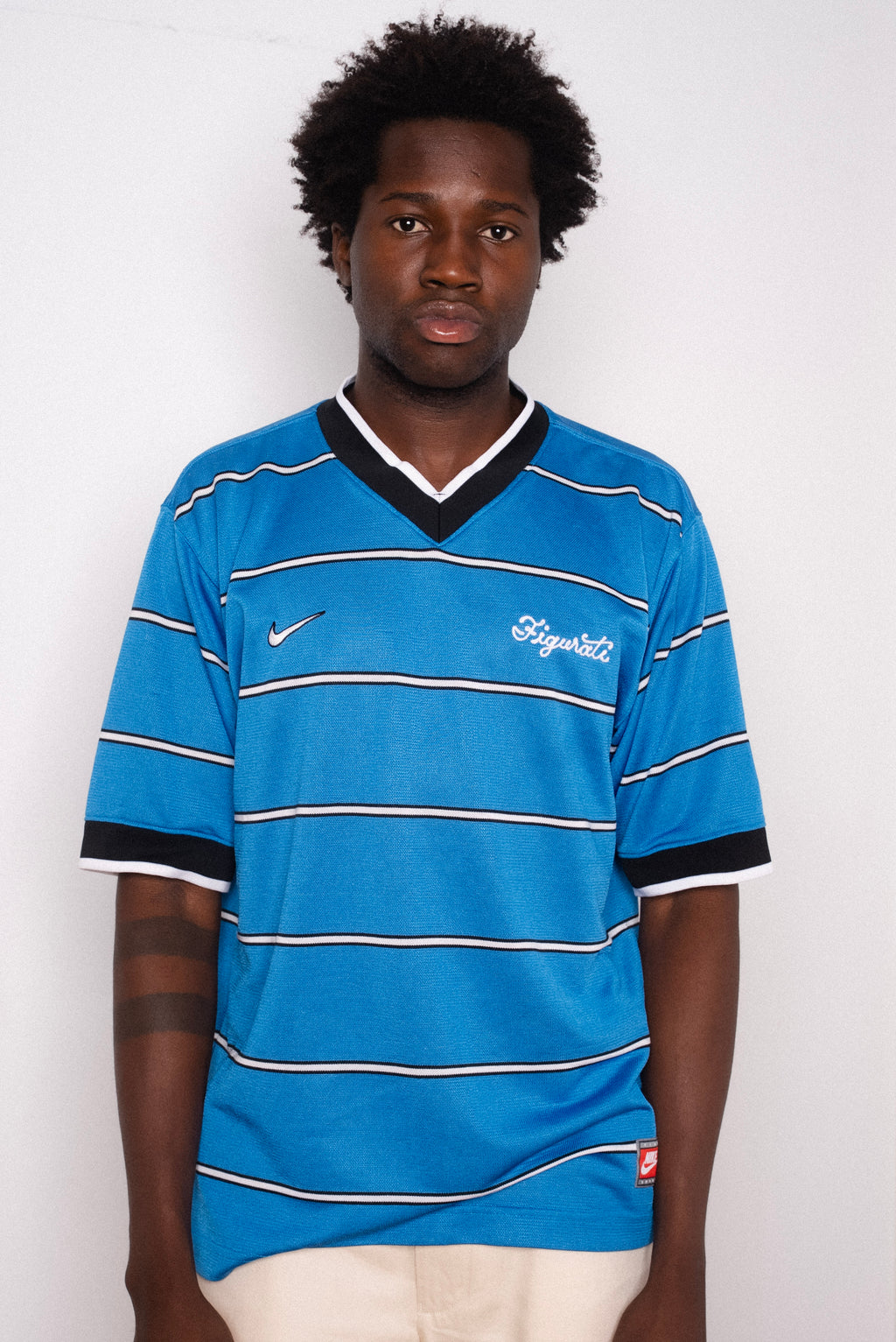 Vintage Nike blue striped short sleeve football shirt with Figurati embroidery, styled