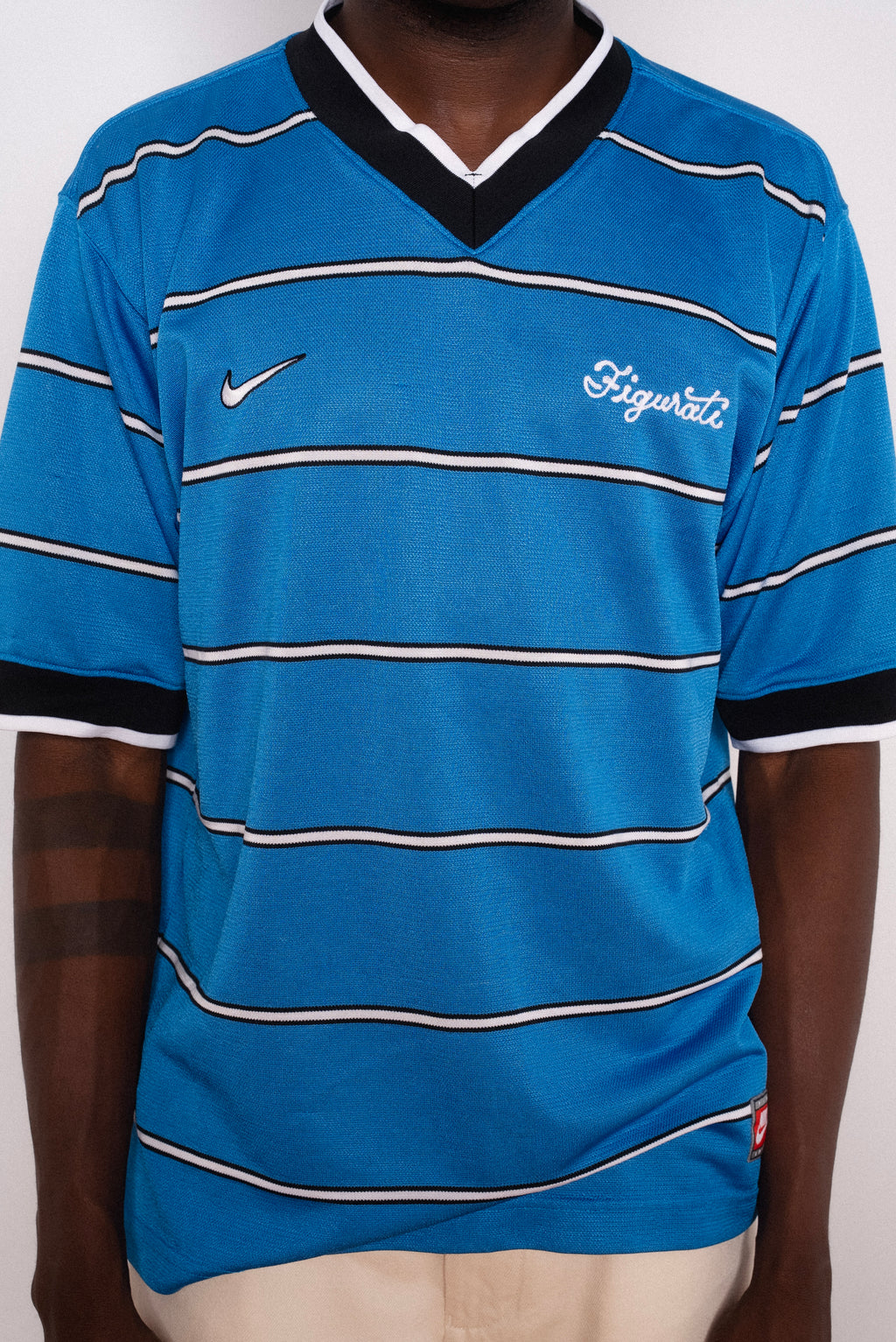 Vintage Nike blue striped short sleeve football shirt with Figurati embroidery, styled