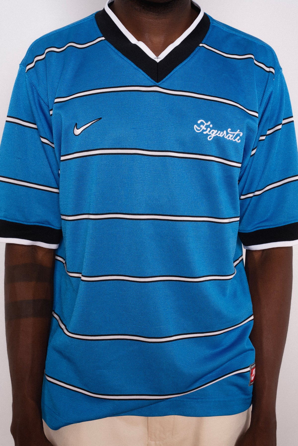 Vintage Nike blue striped short sleeve football shirt with Figurati embroidery, styled