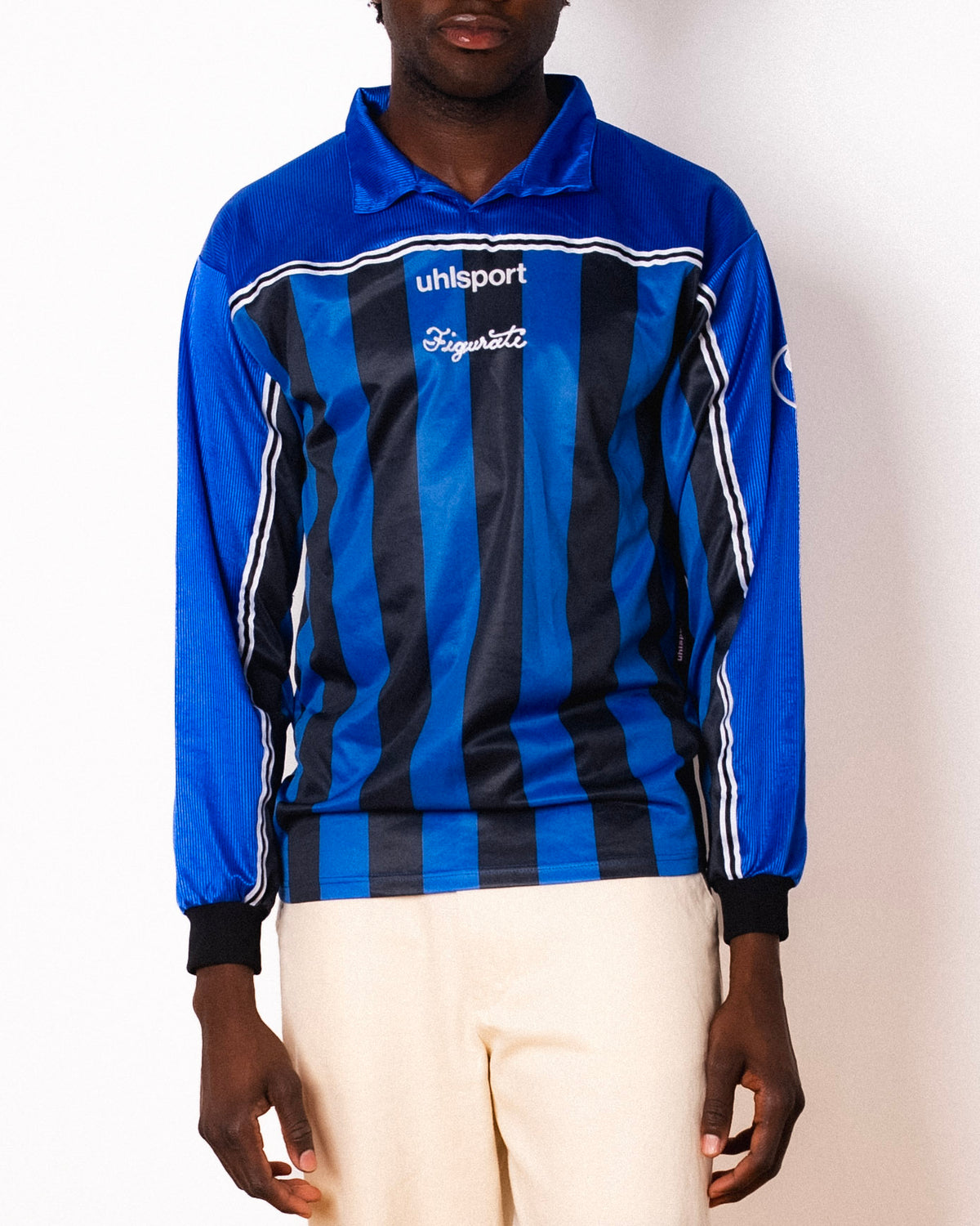Vintage Uhlsport blue and black striped long sleeve football shirt with Figurati embroidery, front