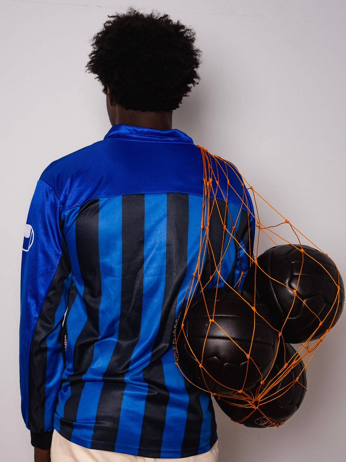 Vintage Uhlsport blue and black striped long sleeve football shirt with Figurati embroidery, back