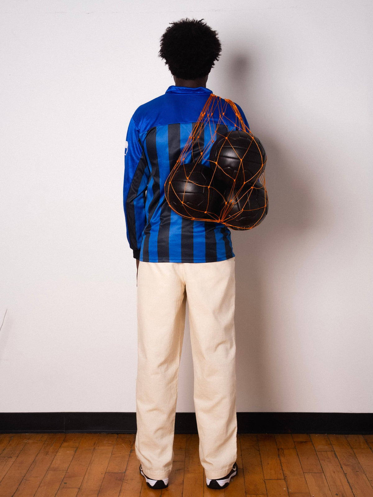 Vintage Uhlsport blue and black striped long sleeve football shirt with Figurati embroidery, full body back