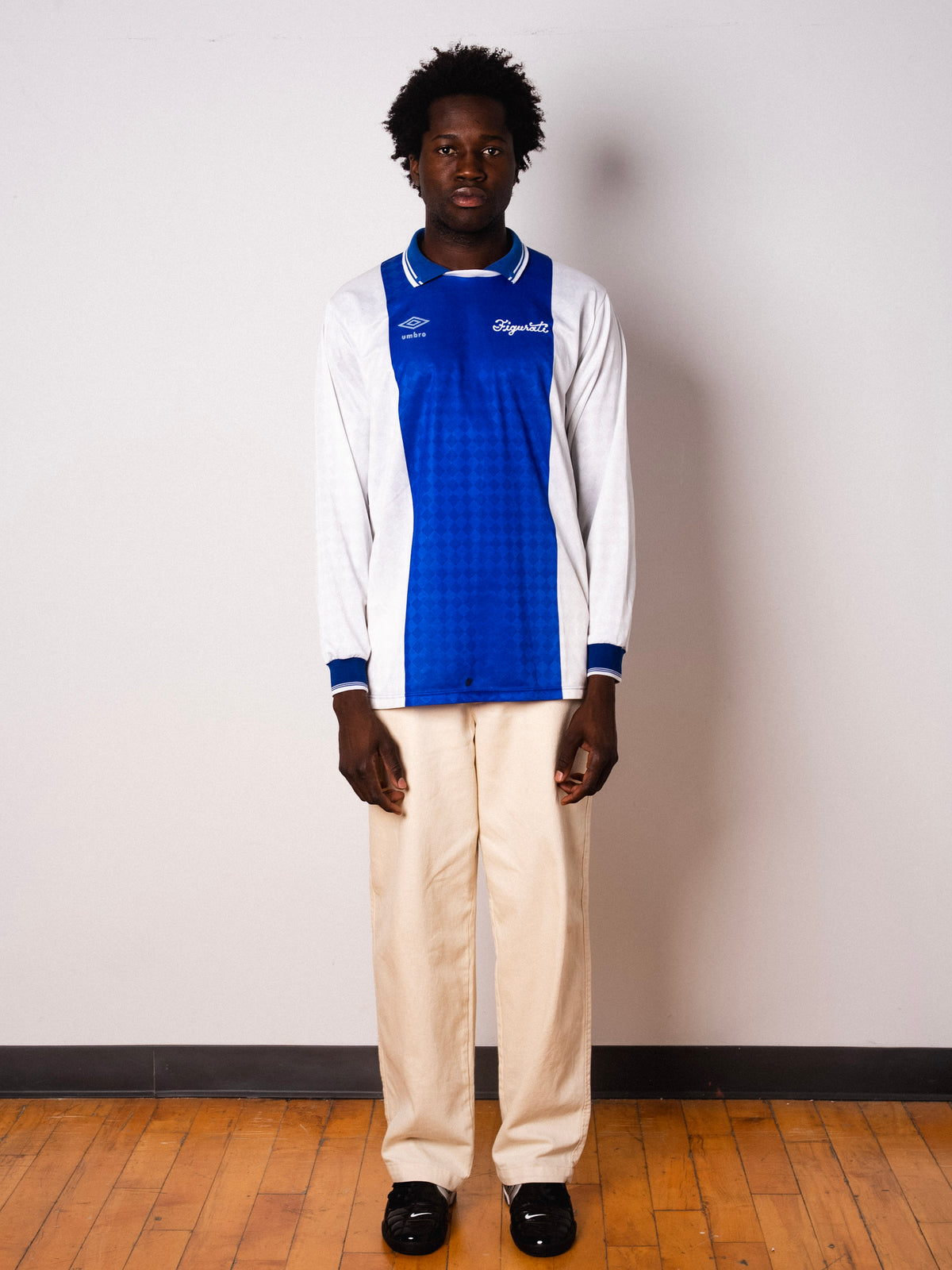 Vintage Umbro blue and white long sleeve football shirt with Figurati embroidery, full body front