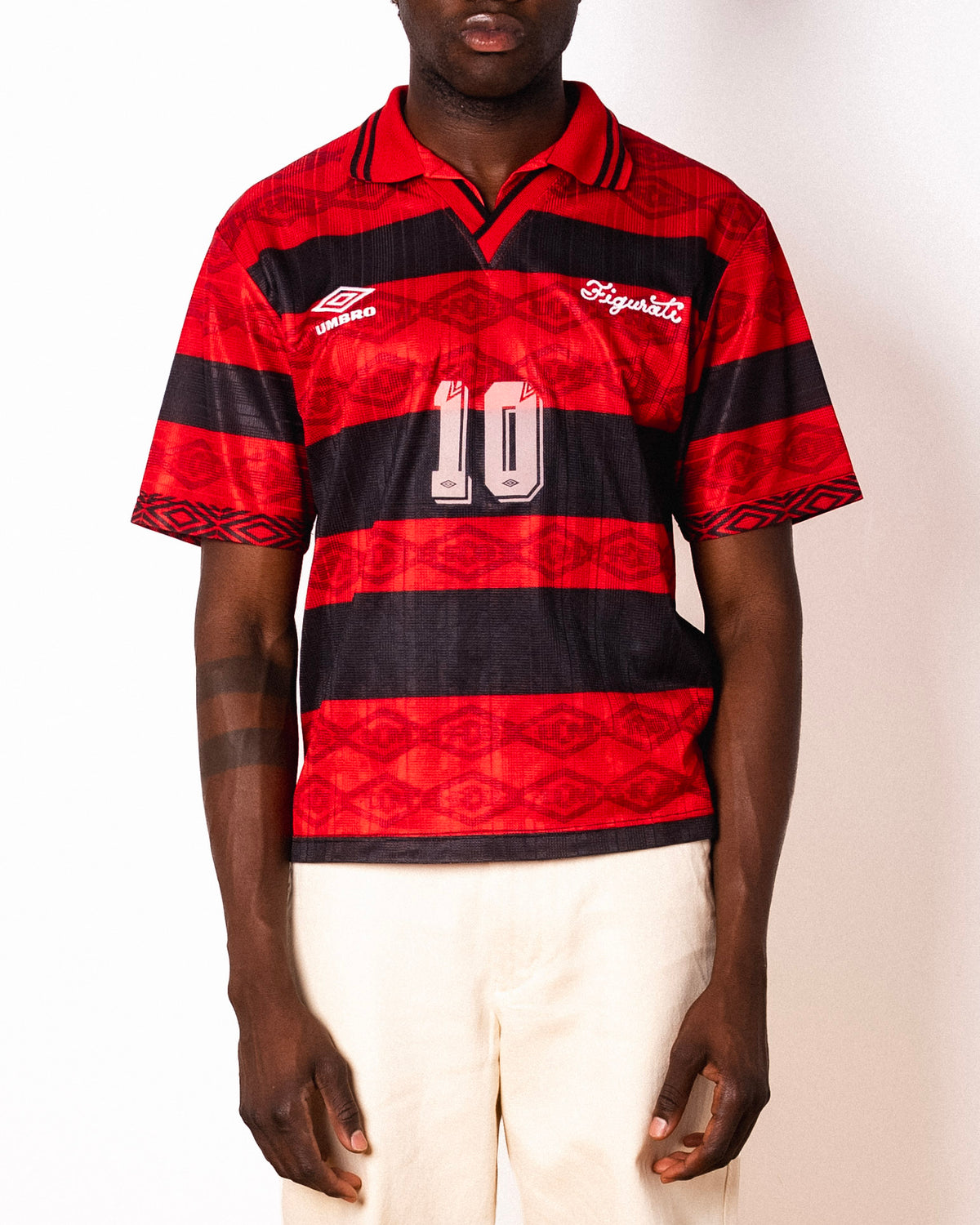 Vintage Umbro red and black striped short sleeve football shirt with Figurati embroidery, front