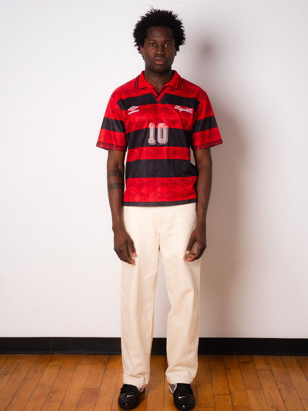 Vintage Umbro red and black striped short sleeve football shirt with Figurati embroidery, full body front