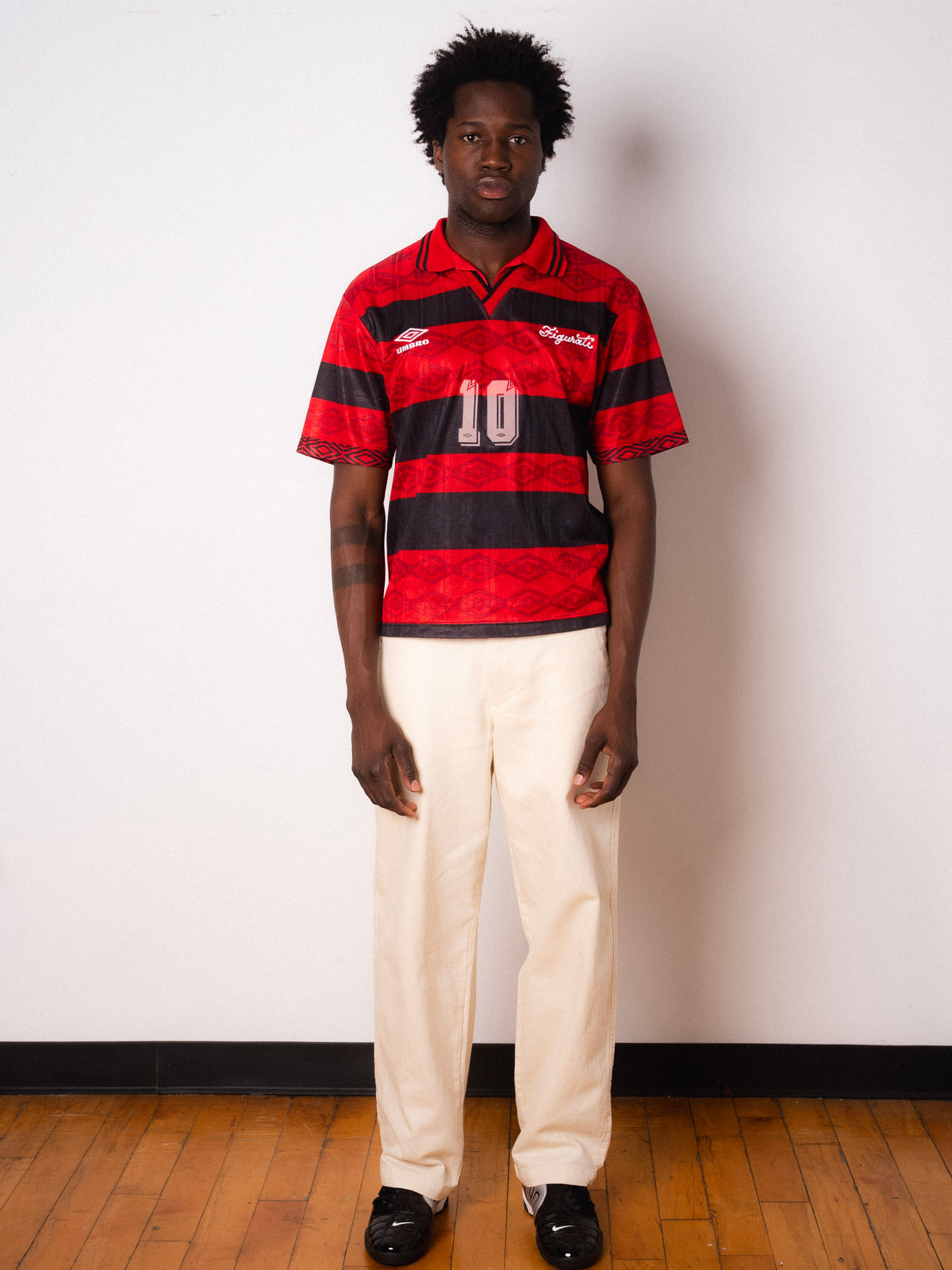 Vintage Umbro red and black striped short sleeve football shirt with Figurati embroidery, full body front