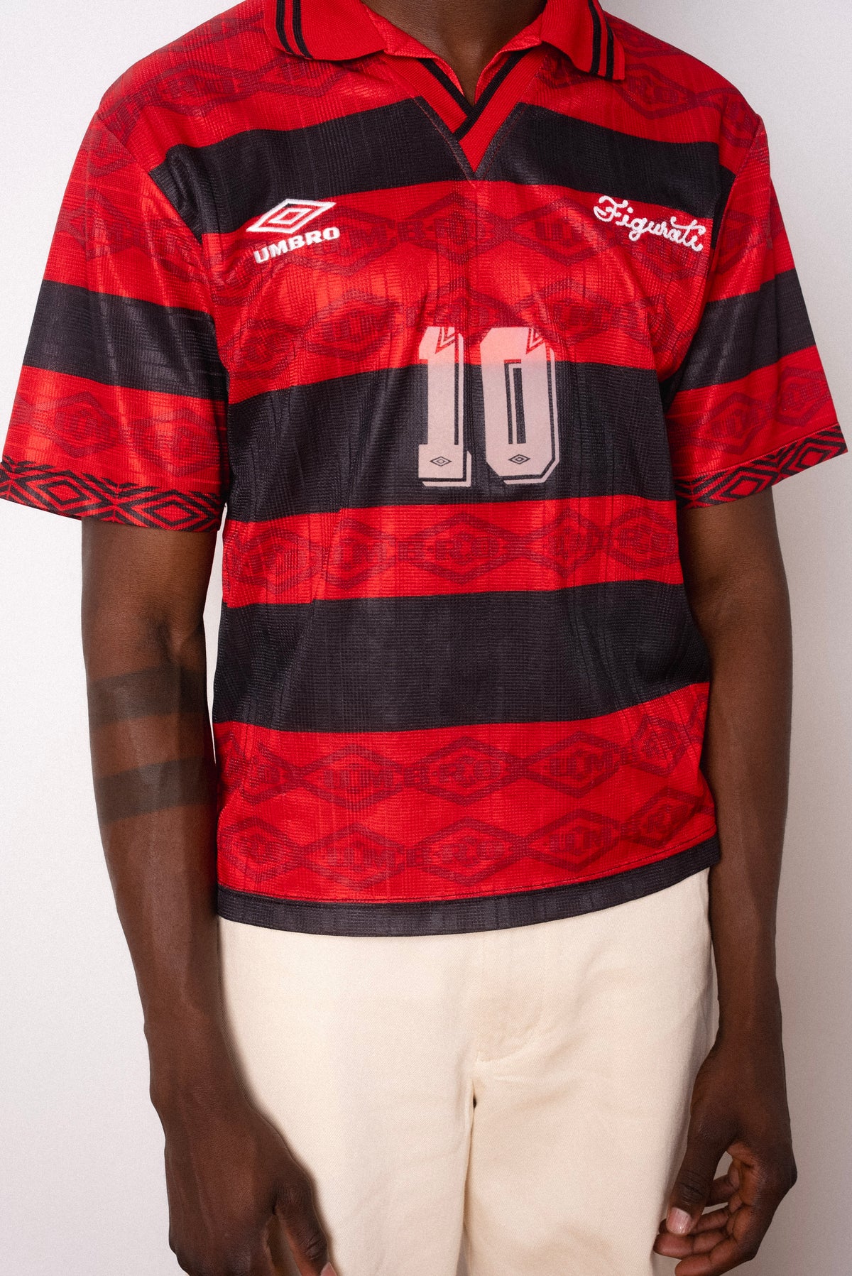 Vintage Umbro red and black striped short sleeve football shirt with Figurati embroidery, styled