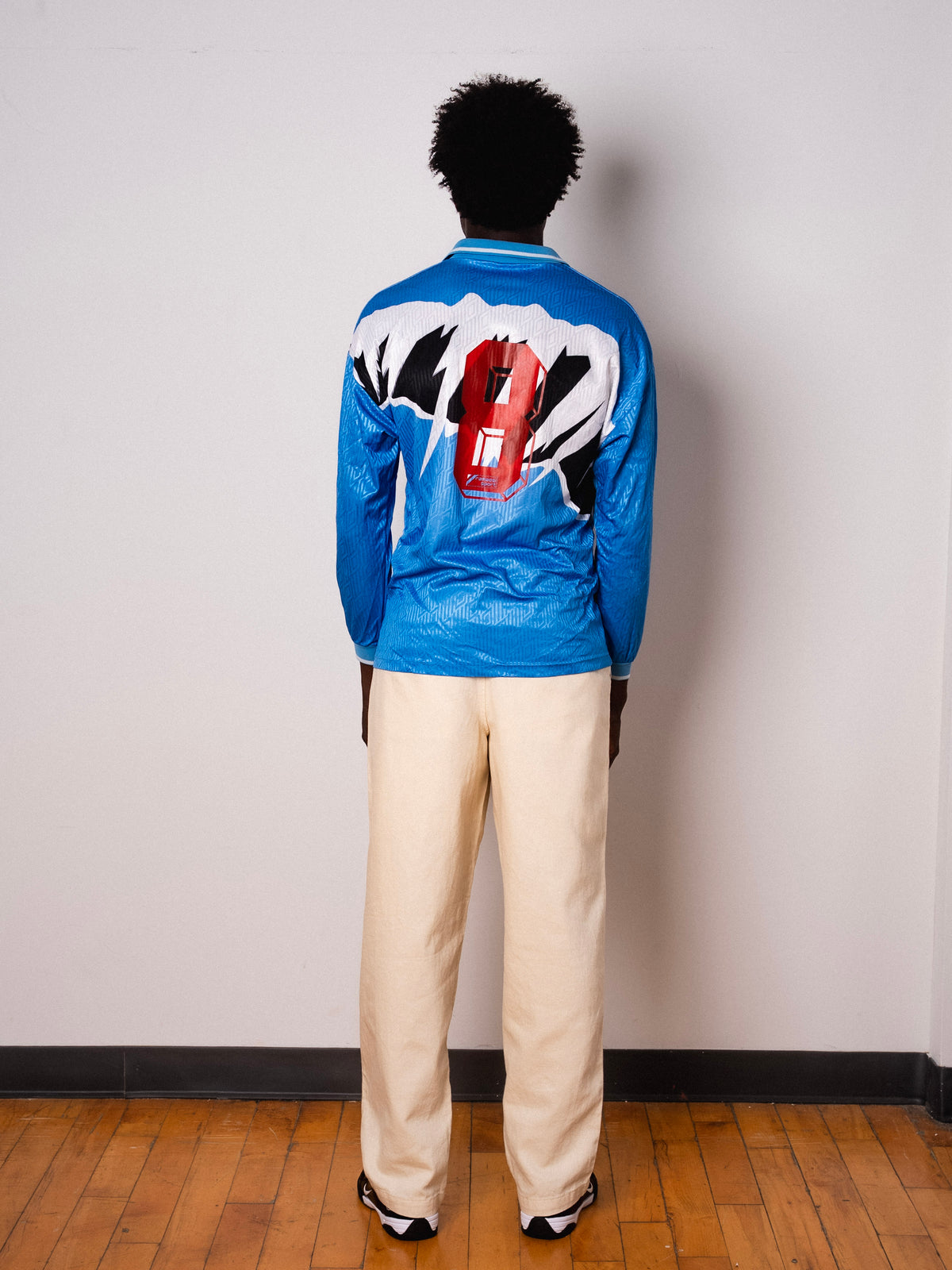 Vintage Umbro sky blue abstract print long sleeve football shirt with Figurati embroidery, full body back